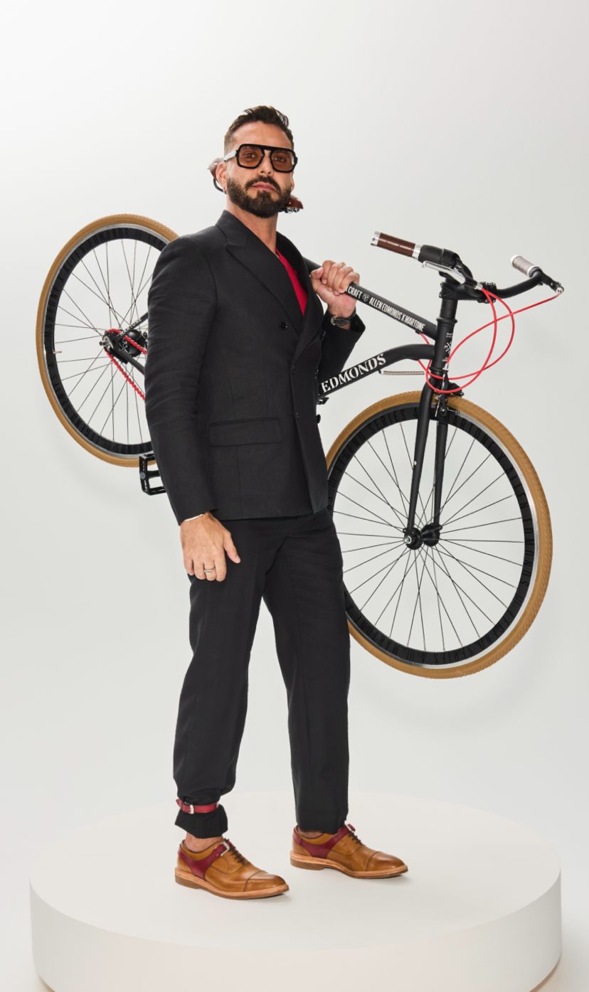 lorenzo martone in the park avenue velo holding a bicycle