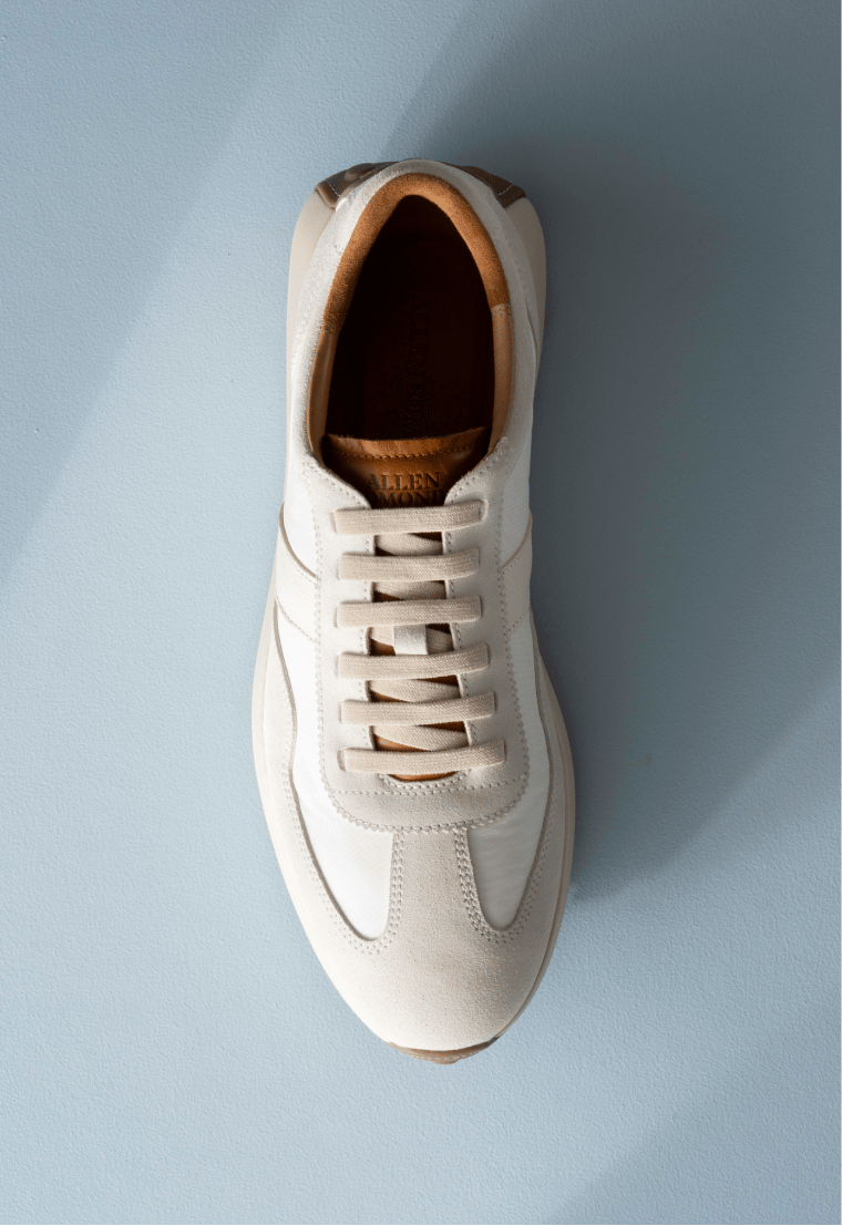 Men’s gray textured leather sneaker with tan rubber sole and brown leather lining